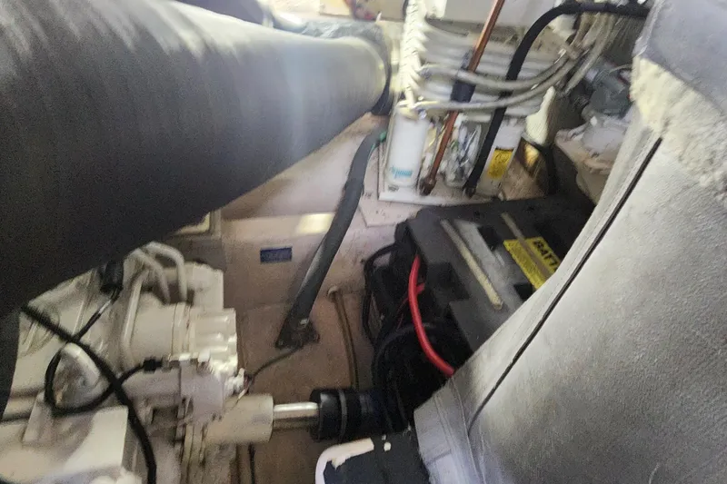 Slide: The Image of Engine room of 1998 Sea Ray 630 Super Sun Sport with visible components and wiring. - 39