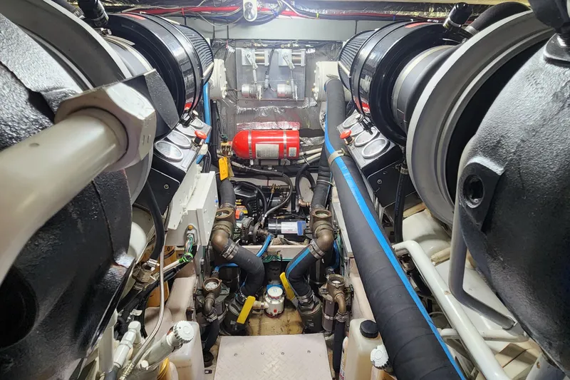 Slide: The Image of Engine room of 1998 Sea Ray 630 Super Sun Sport with visible machinery and components. - 43