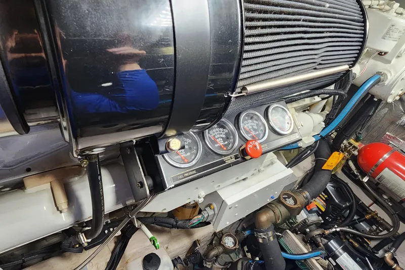 Slide: The Image of Engine compartment of a 1998 Sea Ray 630 Super Sun Sport with gauges and components. - 44