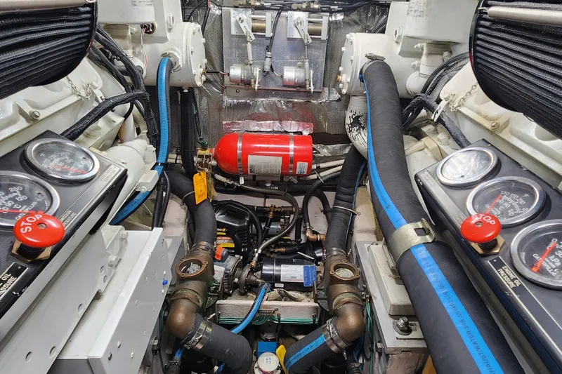 Slide: The Image of Engine room of a 1998 Sea Ray 630 Super Sun Sport with gauges and fire extinguisher. - 45