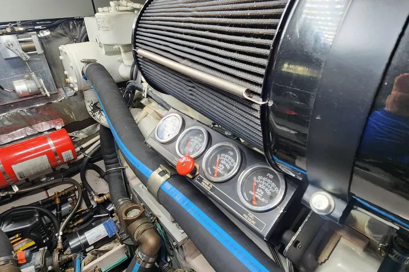 Slide: The Image of Engine compartment of a 1998 Sea Ray 630 Super Sun Sport with gauges and components. - 46