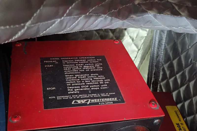 Slide: The Image of Red diesel generator control panel with operation instructions, Sea Ray 630 Super Sun Sport, 1998. - 47