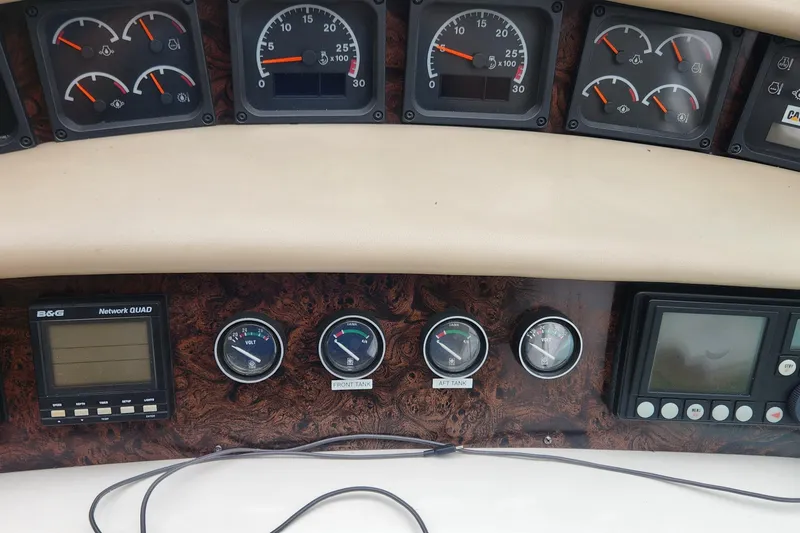 Slide: The Image of Dashboard of a 1998 Sea Ray 630 Super Sun Sport with gauges and navigation equipment. - 56