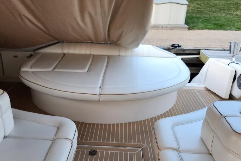 Slide: The Image of 1998 Sea Ray 630 Super Sun Sport interior with white leather seating and teak flooring. - 7