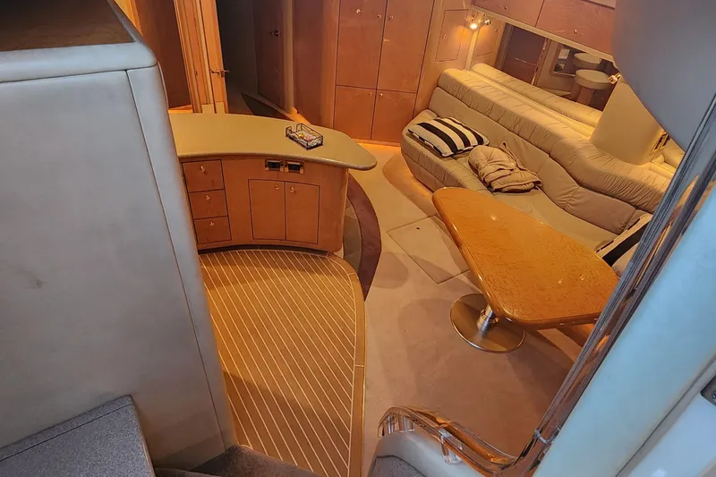 Slide: The Image of Luxurious interior of 1998 Sea Ray 630 Super Sun Sport yacht with elegant seating and cabinetry. - 9