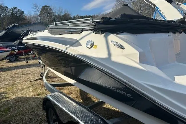 Slide: The Image of 2021 Hurricane SunDeck Sport 185 OB boat on trailer, side view, outdoors. - 14