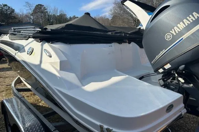Slide: The Image of 2021 Hurricane SunDeck Sport 185 OB boat with Yamaha outboard motor, on a trailer. - 16