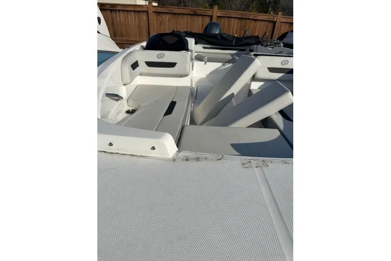 Slide: The Image of 2021 Hurricane SunDeck Sport 185 OB boat interior with white seating and deck. - 18