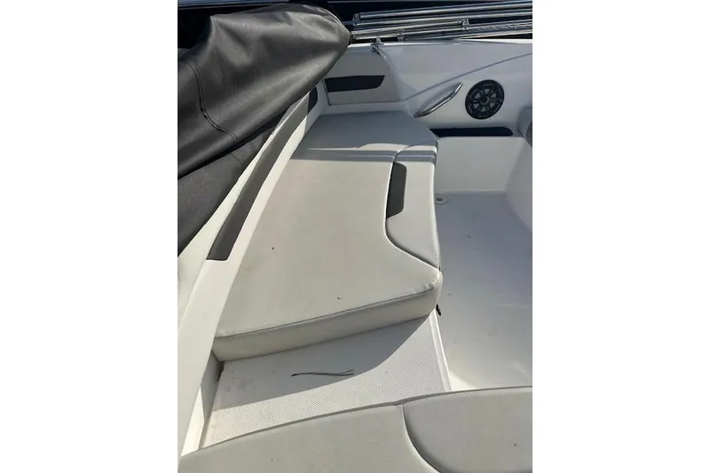 Slide: The Image of 2021 Hurricane SunDeck Sport 185 OB interior with cushioned seating and speaker. - 20