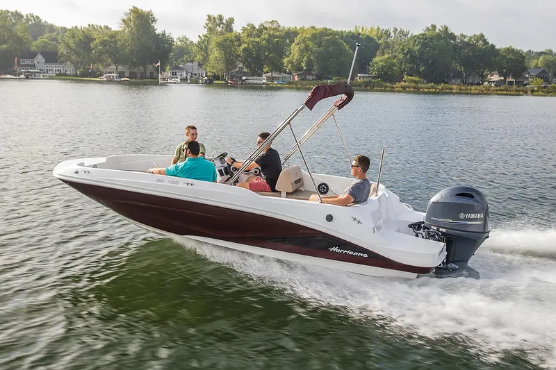 Slide: The Image of Manufacturer Provided Image: 2021 Hurricane SunDeck Sport 185 OB boat cruising on a lake with passengers. - 3