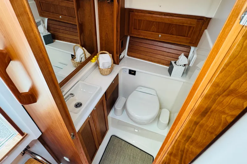 Slide: The Image of Luxurious 2025 Back Cove 34O yacht bathroom with wooden cabinetry and modern fixtures. - 12