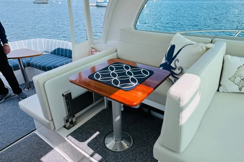 Slide: The Image of Luxurious interior of 2025 Back Cove 34O yacht with elegant seating and nautical decor. - 24