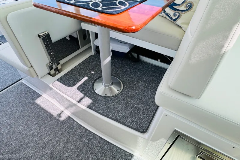 Slide: The Image of Interior of 2025 Back Cove 34O boat with elegant seating and table design. - 25