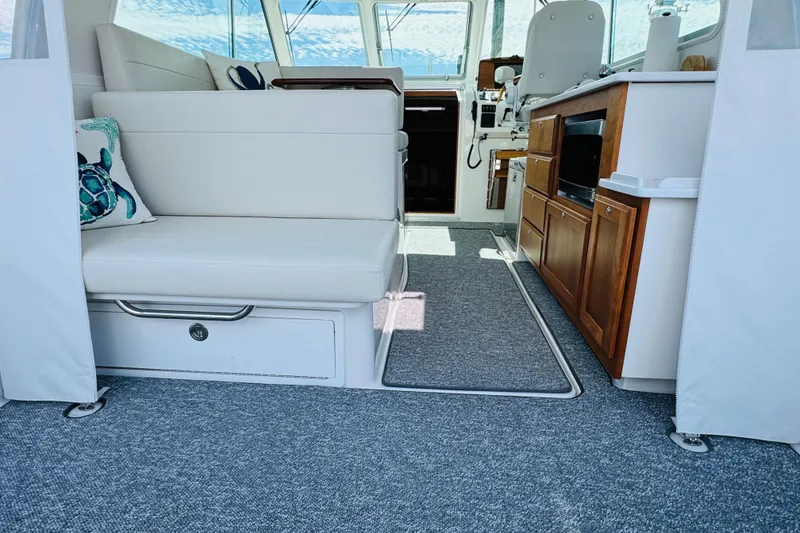 Slide: The Image of Interior of 2025 Back Cove 34O boat with seating and kitchenette. - 27