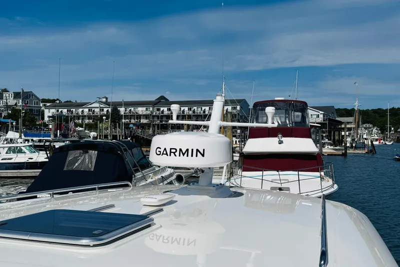 Slide: The Image of 2025 Back Cove 34O yacht with Garmin equipment docked at a marina. - 35