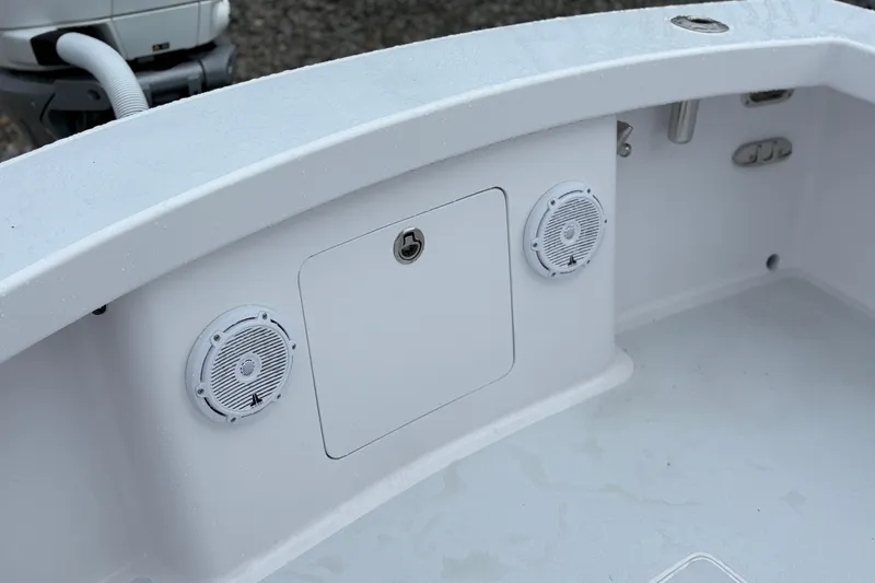 Slide: The Image of 2025 Weaver 270 boat interior with speakers and storage compartment. - 11