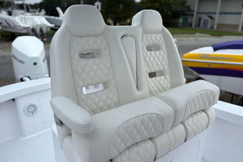 Slide: The Image of Luxurious white leather boat seats on a 2025 Weaver 270, featuring diamond stitching. - 9