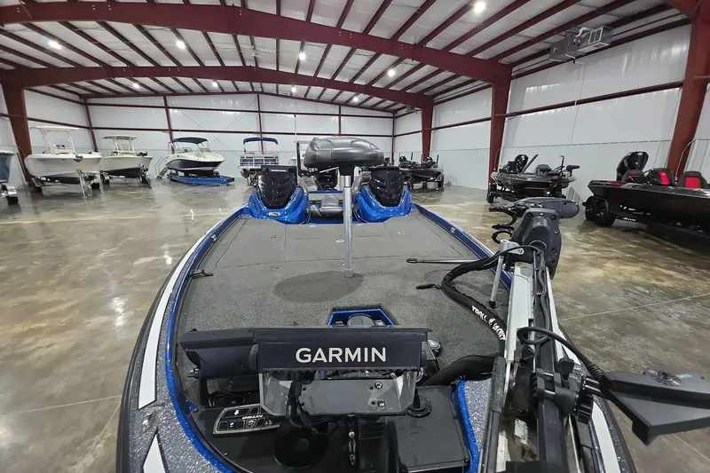 Slide: The Image of 2016 Nitro Z21 boat with Garmin equipment in a spacious indoor showroom. - 11