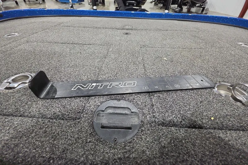 Slide: The Image of 2016 Nitro Z21 boat deck with measurement tool and carpeted surface. - 12