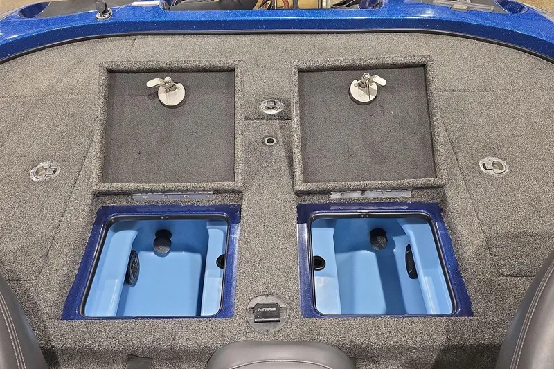 Slide: The Image of 2016 Nitro Z21 boat deck with storage compartments and blue interior. - 13