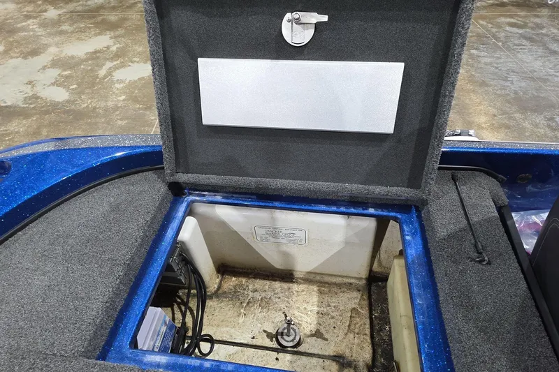 Slide: The Image of Open storage compartment of a 2016 Nitro Z21 boat, showing interior details. - 15