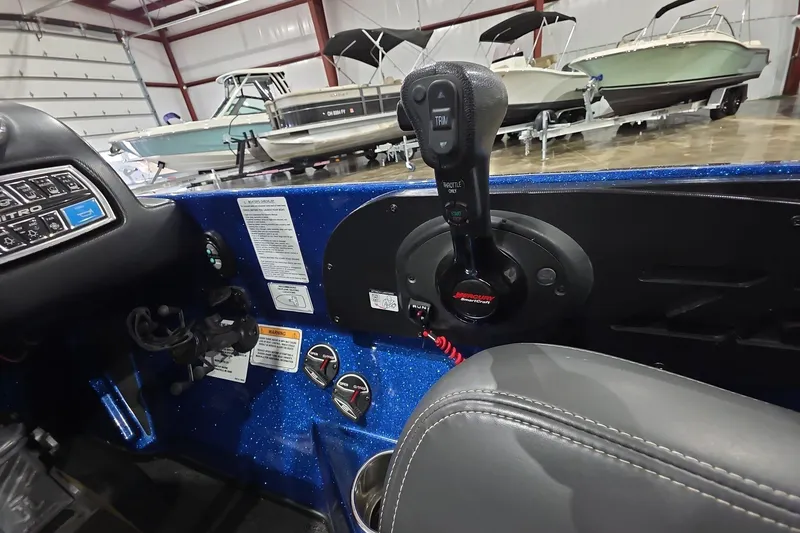 Slide: The Image of Interior of a 2016 Nitro Z21 boat with control panel and throttle lever. - 19