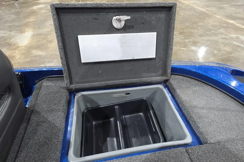 Slide: The Image of Open storage compartment in 2016 Nitro Z21 boat, featuring a spacious interior and secure latch. - 27
