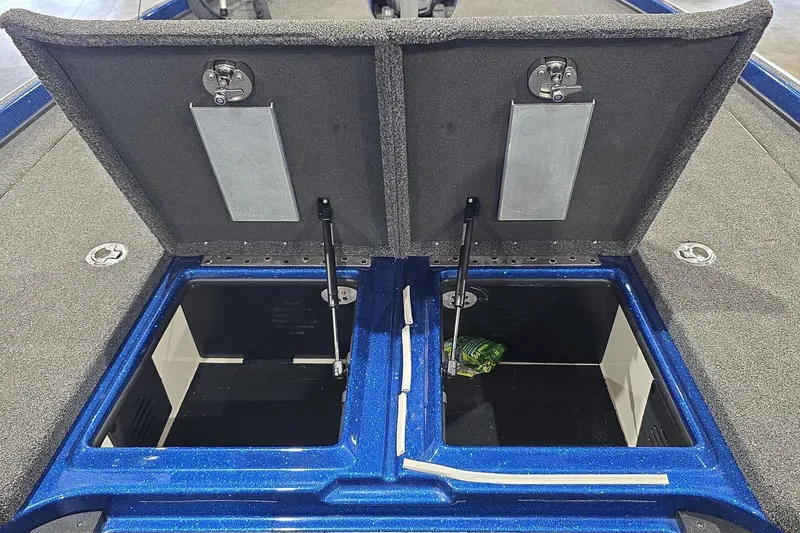 Slide: The Image of 2016 Nitro Z21 boat storage compartments open, showcasing interior space and design. - 29