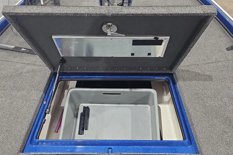 Slide: The Image of 2016 Nitro Z21 boat storage compartment with open lid and interior bin. - 30