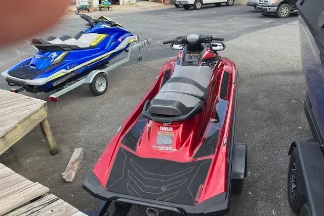 Slide: The Image of 2019 Yamaha WaveRunner VX Limited in red, parked on a trailer in a lot. - 4