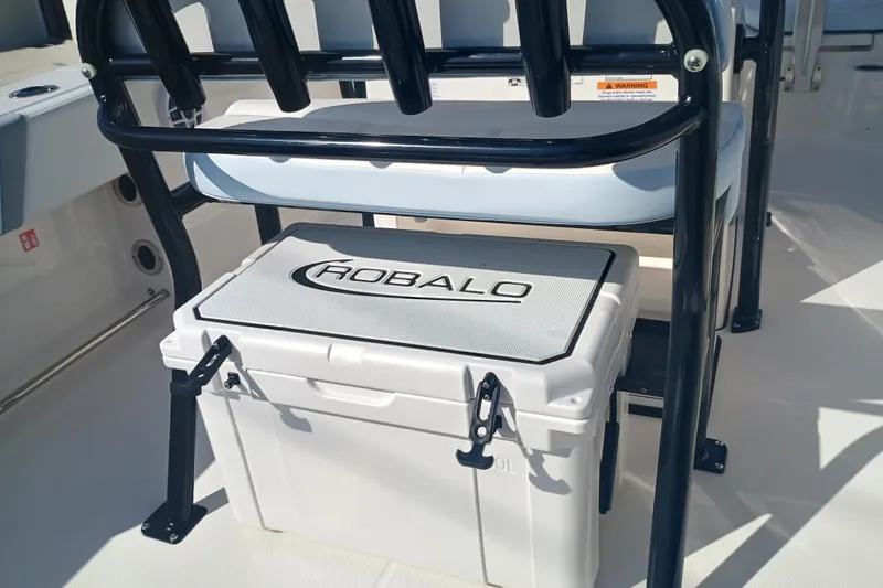 Slide: The Image of 2026 Robalo R200 Center Console boat with integrated cooler under seat. - 13