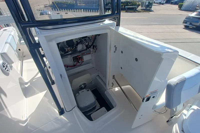 Slide: The Image of 2026 Robalo R200 Center Console boat interior with open storage compartment. - 15