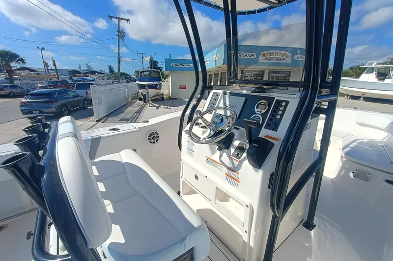 Slide: The Image of 2026 Robalo R200 Center Console boat interior with steering wheel and controls. - 17