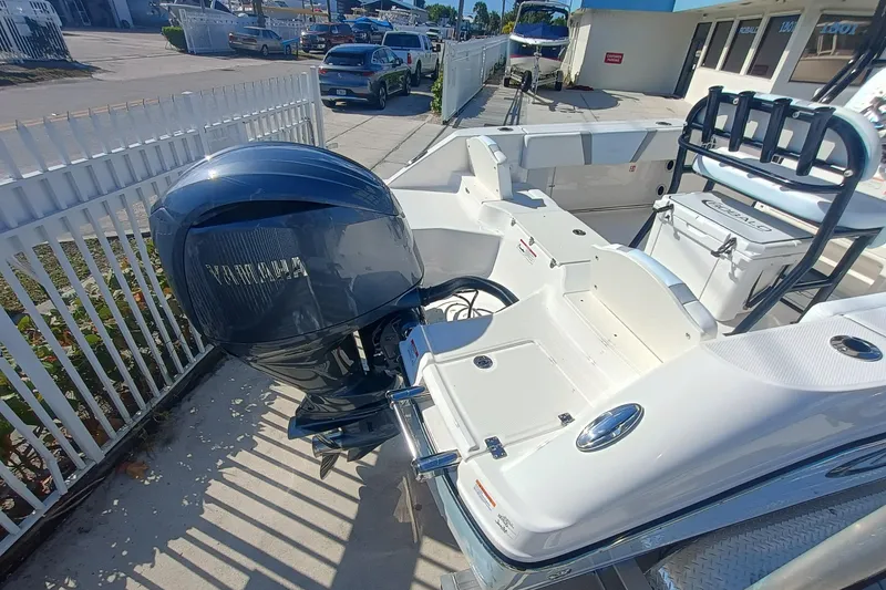 Slide: The Image of 2026 Robalo R200 Center Console boat with Yamaha outboard motor, docked outdoors. - 18