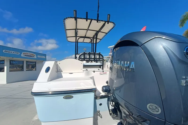 Slide: The Image of 2026 Robalo R200 Center Console boat with Yamaha engine at a dealership. - 20