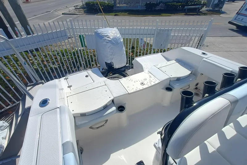 Slide: The Image of 2026 Robalo R200 Center Console boat interior with seating and rod holders. - 23
