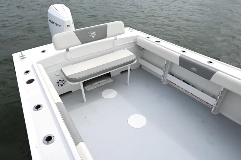 Slide: The Image of 2022 Steiger Craft 255DV Miami boat interior with seating and rod holders. - 16
