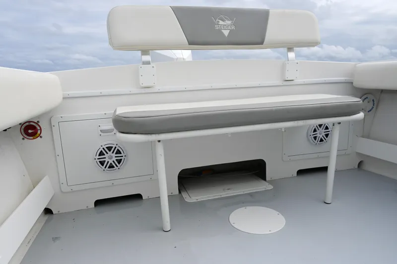 Slide: The Image of 2022 Steiger Craft 255DV Miami boat interior with cushioned seating and storage compartments. - 18