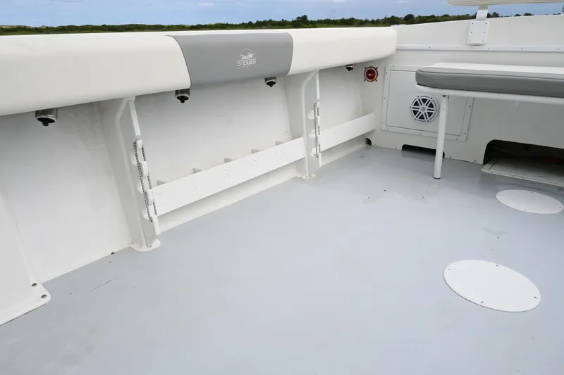 Slide: The Image of 2022 Steiger Craft 255DV Miami boat deck with seating and storage compartments. - 20