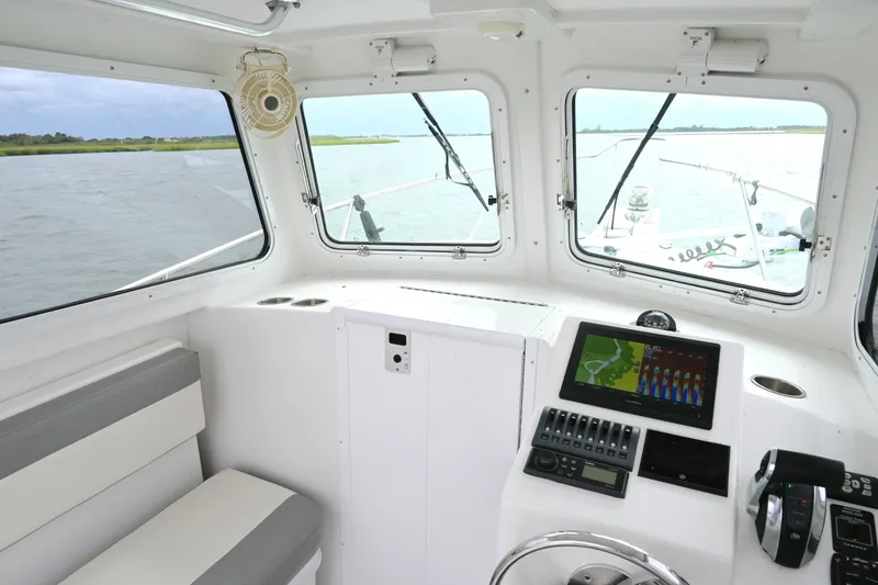 Slide: The Image of Interior view of 2022 Steiger Craft 255DV Miami boat with navigation system. - 27