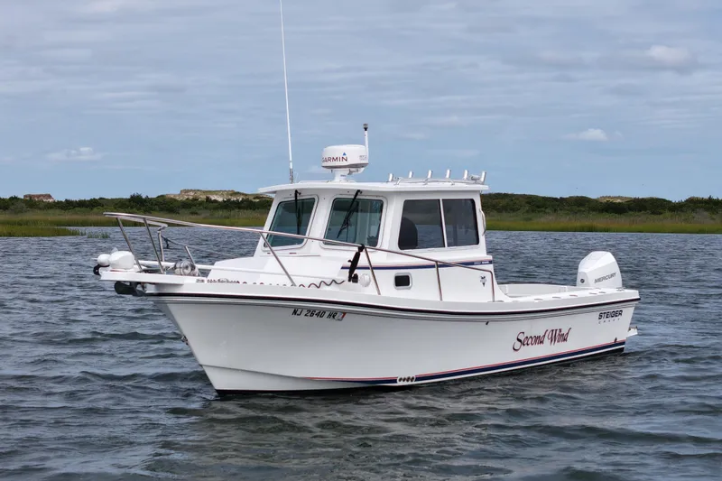 Slide: The Image of 2022 Steiger Craft 255DV Miami boat on water, side view. - 3