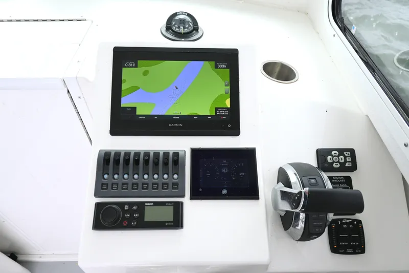 Slide: The Image of Steiger Craft 255DV Miami 2022 boat dashboard with navigation and control systems. - 30