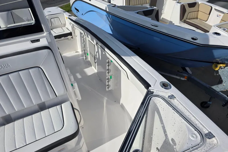 Slide: The Image of 2025 Yamaha Boats 252 FSH Sport interior with sleek seating and modern design. - 14