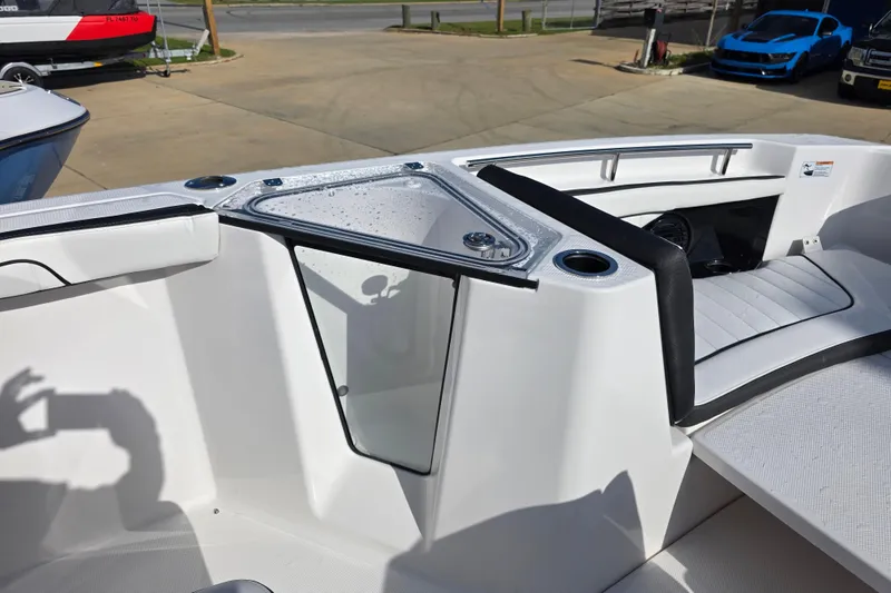 Slide: The Image of 2025 Yamaha Boats 252 FSH Sport interior with seating and storage features. - 8