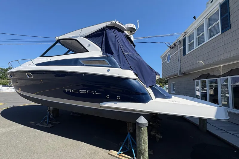 Slide: The Image of Interior of 2013 Regal 35 Sport Coupe with beige seating and decorative pillows. - 19