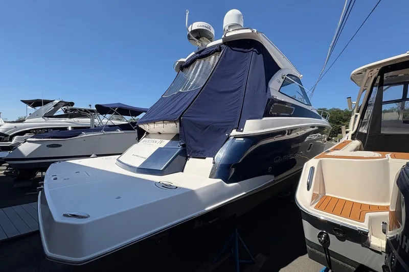 Slide: The Image of Luxurious interior of 2013 Regal 35 Sport Coupe with cream leather seating and wooden accents. - 21