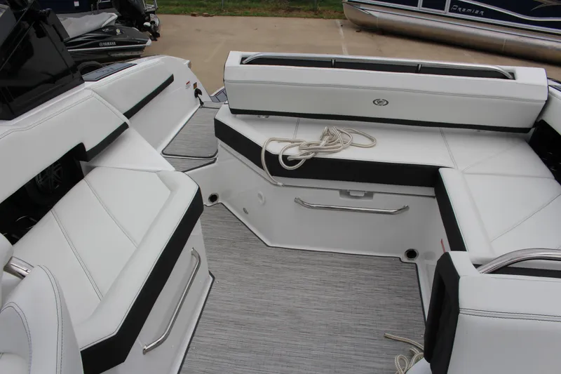 Slide: The Image of 2025 Cobalt R6 boat interior with white seating and rope on deck. - 16