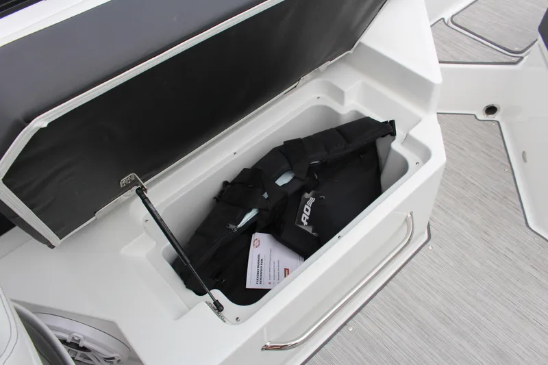 Slide: The Image of Storage compartment on 2025 Cobalt R6 boat with life jacket inside. - 21