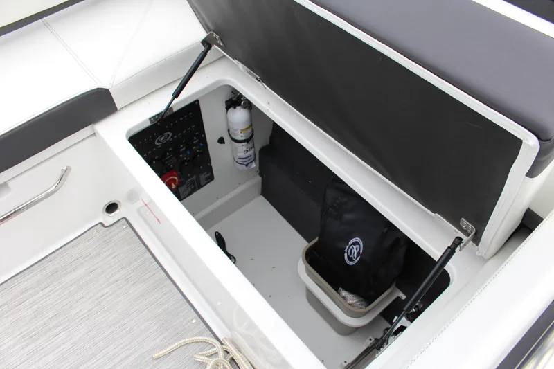 Slide: The Image of Storage compartment in 2025 Cobalt R6 boat with safety equipment and accessories. - 22