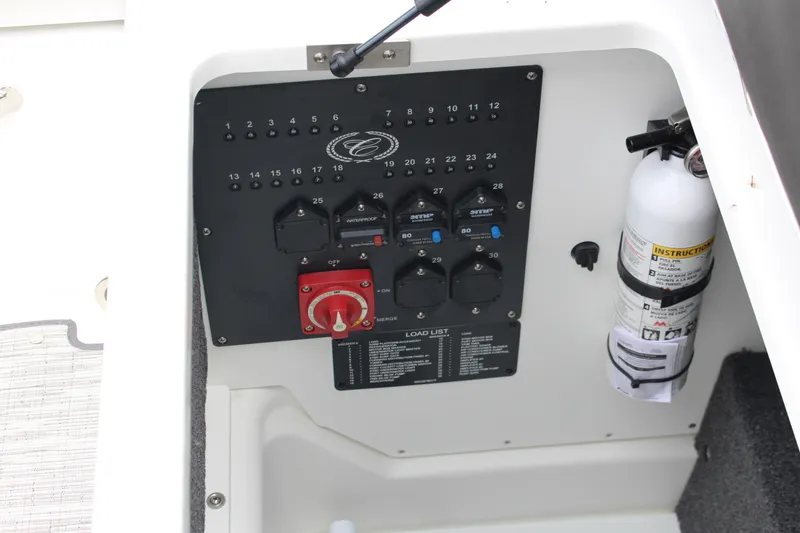 Slide: The Image of Control panel and fire extinguisher in 2025 Cobalt R6 boat interior. - 23